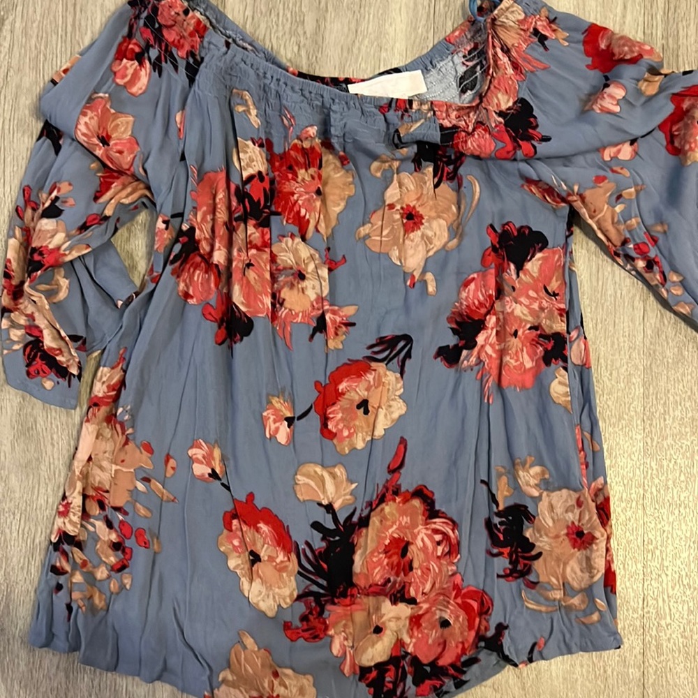 Rose Karlid over the should blouse.